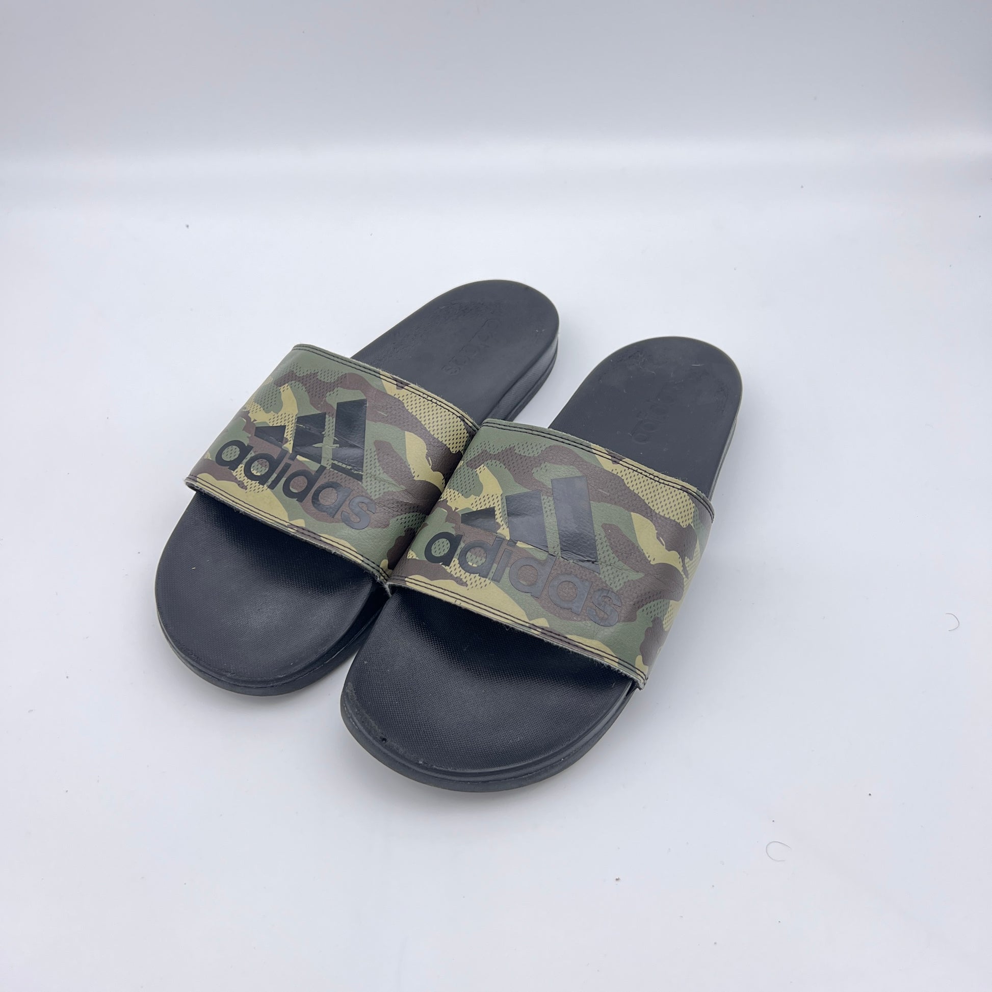 Lightweight adidas athletic slides featuring a contoured Cloudfoam sole and camo bandage strap