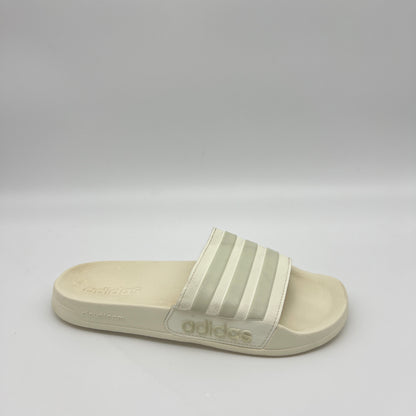 adidas-adilette-shower-slides-ig8776-side-view
off-white-adidas-slides-3-stripes-bandage-upper
adidas-cloudfoam-midsole-detail-shower-sandals
contoured-footbed-adidas-adilette-off-white
adidas-shower-slides-water-resistant-sole