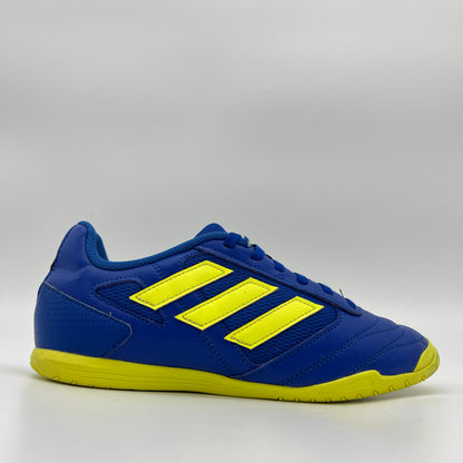 Side profile of a royal blue adidas Super Sala 2 indoor soccer shoe with three bold solar yellow stripes and a matching yellow non-marking rubber sole.