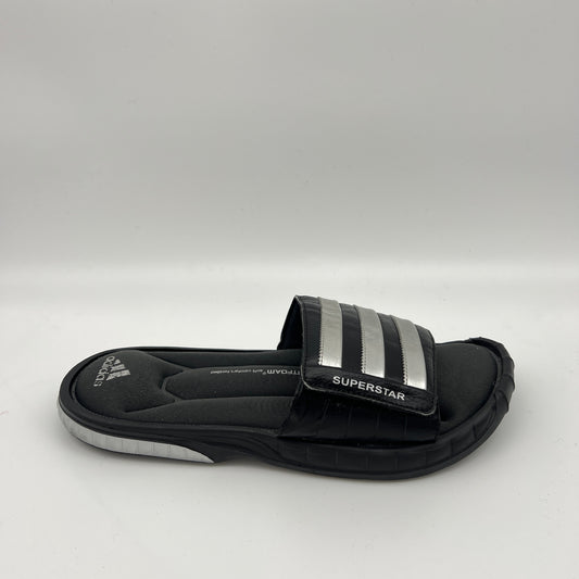 Side view of a black adidas Superstar 3G slide sandal featuring three metallic silver stripes on an adjustable strap and a contoured "Fitfoam" memory foam footbed.